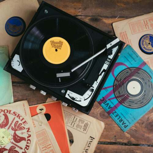 A turntable spinning a Family Room vinyl record